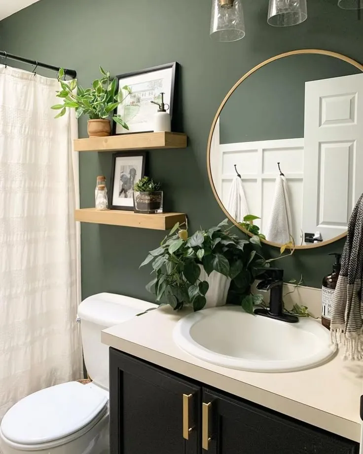 emerald green bathroom with gold accents